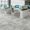 grey commercial carpet tile surface with loop texture